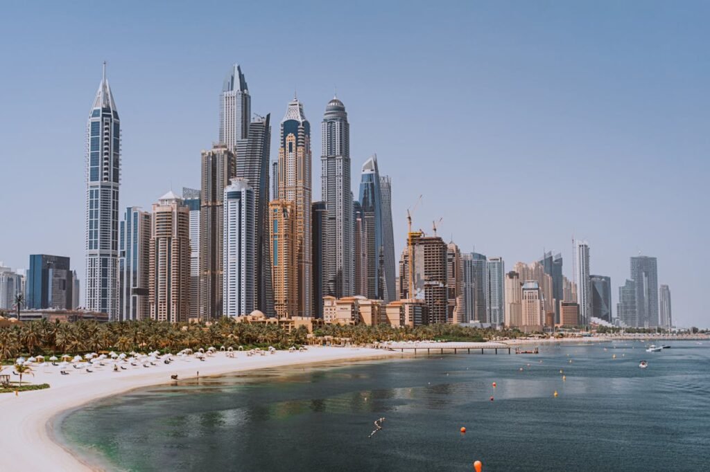 pexels-photo-4491951 A breathtaking view of Dubai's iconic skyline with modern skyscrapers against a clear blue sky.