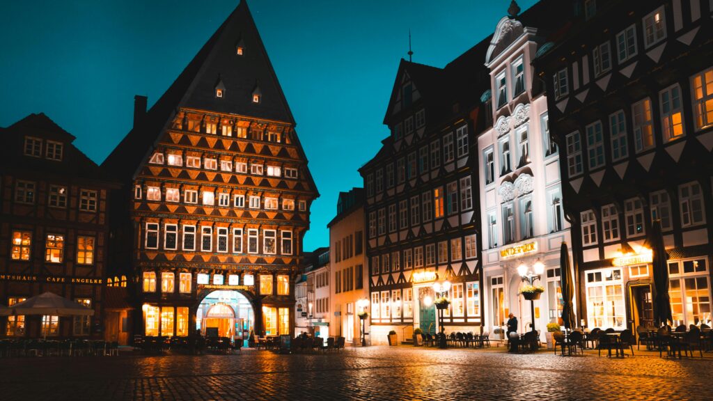 Beautifully illuminated evening scene in Hildesheim, Germany showcasing historical architecture.